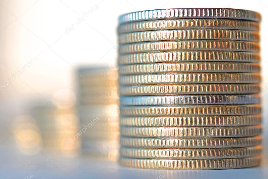 Coins stacked in bars .