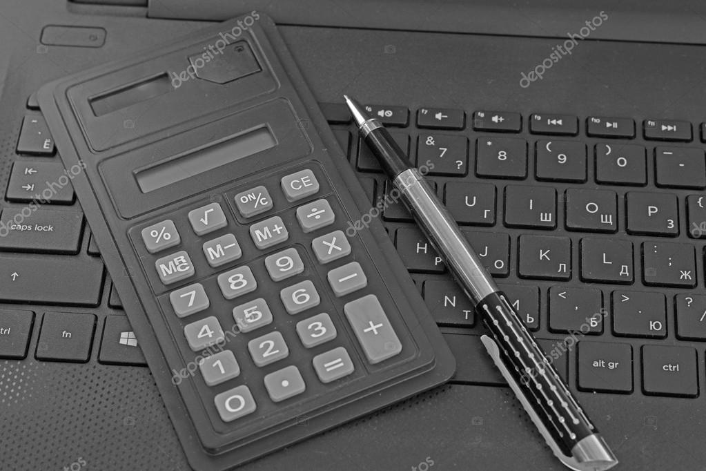 Calculator and laptop keyboar — Stock Photo © vlerijse 87676284
