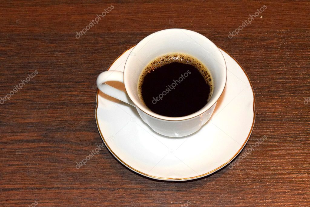 A Cup of black coffee on the table