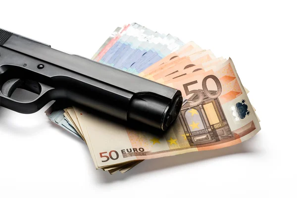 Banknotenbündel mit Waffe Stockbild