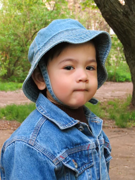 Portrait of a half-year-old boy in the street spring — Stock Photo, Image