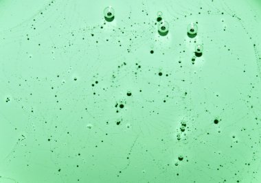 Işık yeşil sıvı doku desenleri ve kabarcıklar ile. Işık yeşil su kabarcıkları ile. Portre