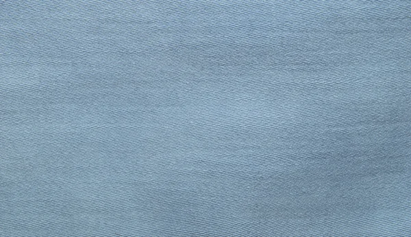 Светло-голубая, бирюзовая текстура денима. Ткань текстуры джинсов. Крупный план — стоковое фото