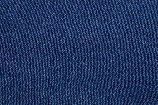 Синий, джинсовая текстура. Ткань текстуры джинсов. Крупный план — стоковое фото