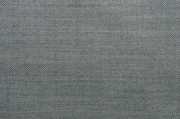 Textura denim gris claro con rayas oblicuas y bandas a lo largo de la textura de tejido de jeans. Primer plano. —  Fotos de Stock