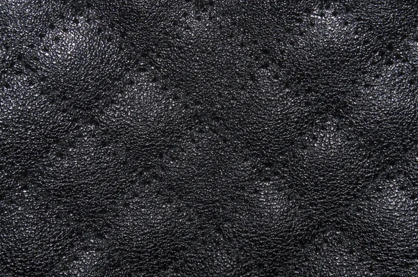 Black leather texture, with large rhombuses in the pattern and veined. Leather texture. Closeup — Stock Fotó