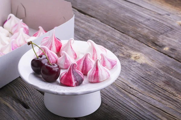 Sweet handmade white red meringue swirls — Stock Photo, Image