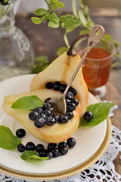 Pear with blueberries and honey — Stock Photo, Image