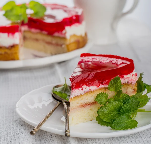 Piece of strawberry cake jelly on white background — Stock Photo, Image