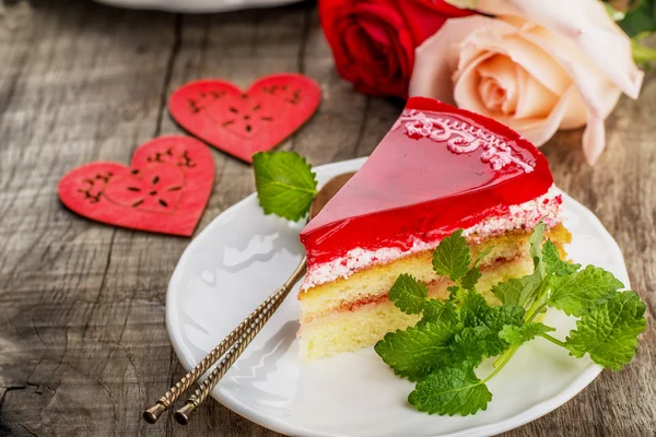 fresh strawberries cake with jelly wooden background