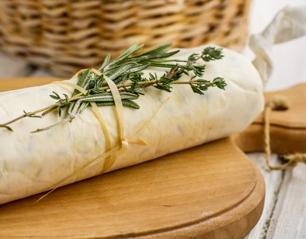 Butter with herbs in parchment paper folded — Stock Photo, Image