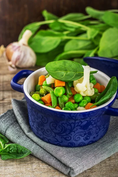 Mix vegetables in a blue ceramic pot — Stock Photo, Image