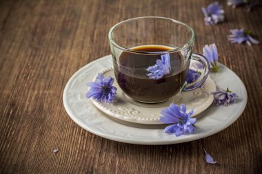 Chicory flowers and tea from chicory. clipart
