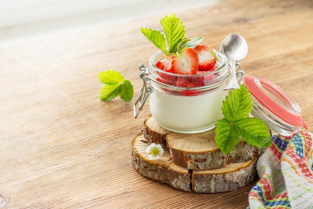 Homemade strawberry yogurt with fresh wild strawberries 