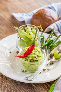 Spicy sweet sauce of fresh meat from the green berries, garlic, pepper,