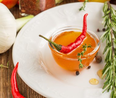 Home sweet fresh hot sauce made with  peaches, pepper