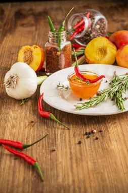 Home sweet fresh hot sauce made with  peaches, pepper