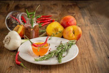 Home sweet fresh hot sauce made with  peaches, pepper