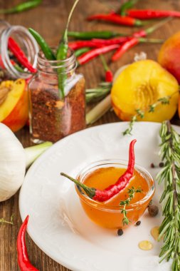 Home sweet fresh hot sauce made with  peaches, pepper