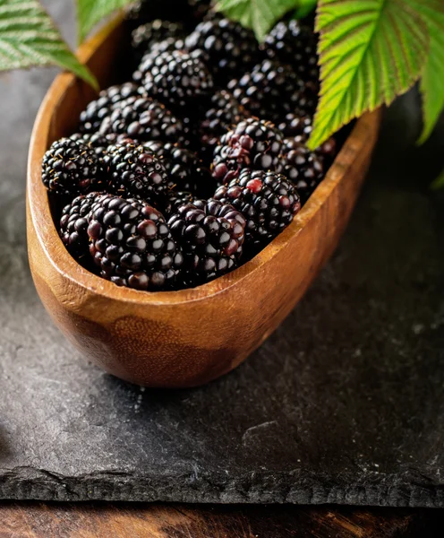 Fresh blackberries in wooden bowl. Top view. — Stock Photo, Image