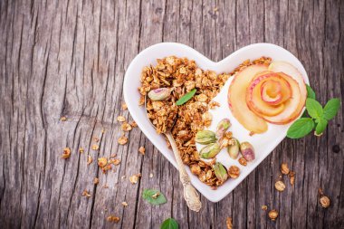 Granola with yogurt and caramel apple slices