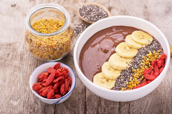 bowl of breakfast with chocolate banana smoothies garnished 