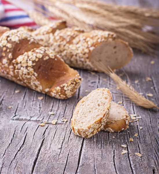 Loaf of oatmeal bread on a gray background — 图库照片