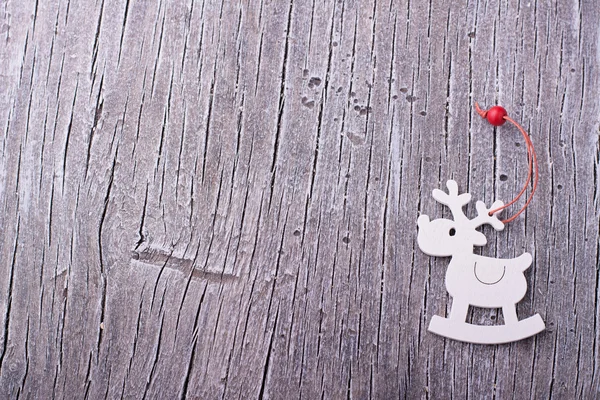 Wooden deer toy on table. — Stock fotografie