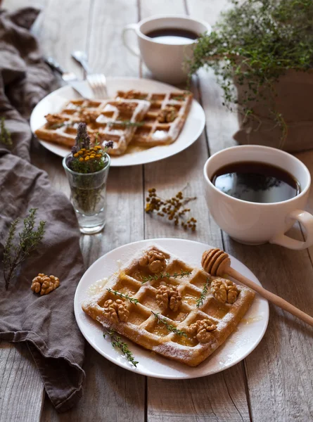 Belgian waffles sweet healthy dessert with honey, nuts, coffee, herbs. — Stock Photo, Image