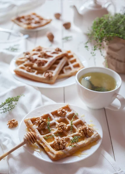Belgian waffles sweet healthy dessert with honey, nuts, green tea. — Stock Photo, Image