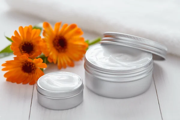 Yogurt cosmetic cream with calendula flowers vitamin spa lotion — Stockfoto