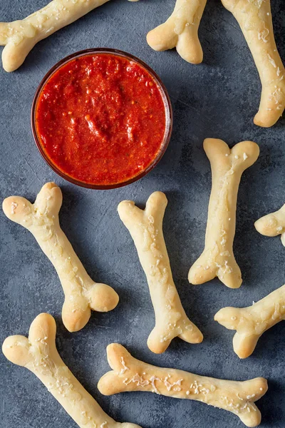 Creative traditional Halloween dough bones cookies vegetarian snack — Stock Photo, Image