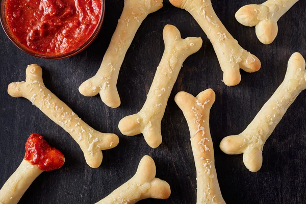 Creative traditional Halloween dough horror bones cookies vegetarian treat snack — Stock Photo, Image