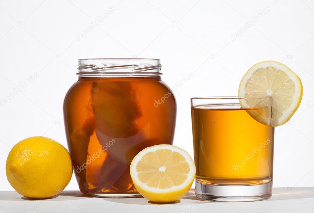 Kombucha super food pro biotic beverage in glass with lemon on w