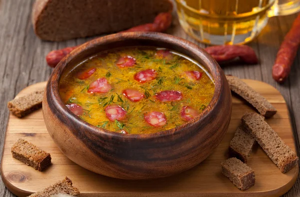 Traditional beer soup with cheese sausage dill croutons and bread — Stock Photo, Image