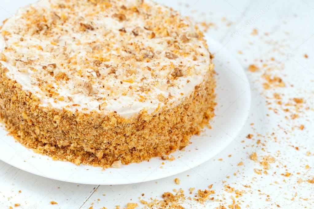 Gourmet easter carrot cake with cream and nut crumbs