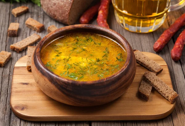 Chicken noodle healthy broth soup with croutons on vintage backg — Stock Photo, Image