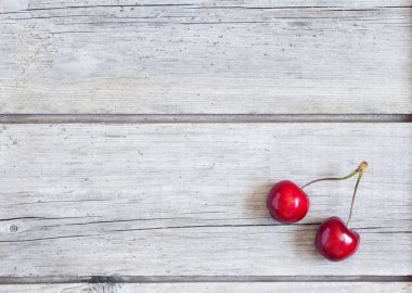 Cherry on vintage wooden rustic background. Natural texture wallpapper design.