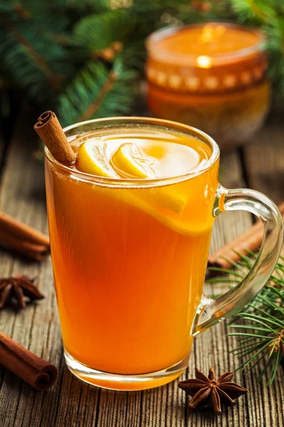 Traditional hot toddy winter drink with spices recipe. Healthy organic homemade holiday celebration beverage in glass. Vintage wooden background. — Stock Photo, Image