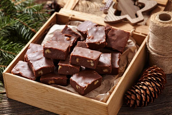 Fudge chocolate christmas homemade dessert in wooden box on vintage table background — Stock Fotó