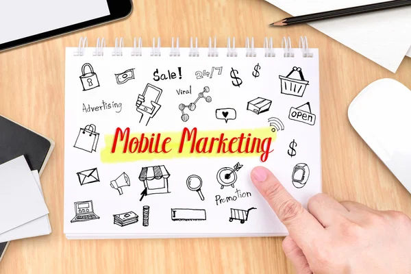 Hand pointing at Mobile Marketing