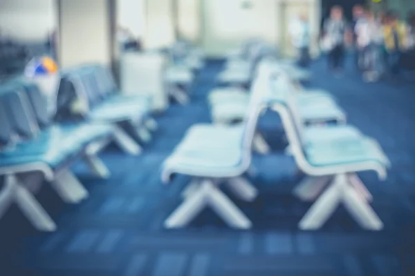 Seat at departure terminal with bokeh light — Stock Photo, Image