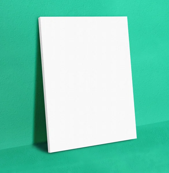 Blank white poster canvas frame leaning at green concrete paint — Stock Photo, Image