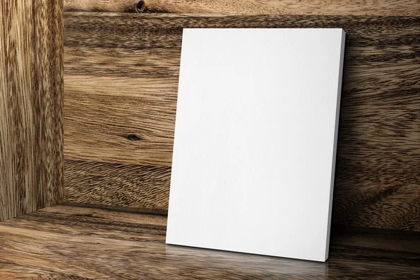 Πλαίσιο κενό λευκό καμβά που ακουμπά στο ξύλο τοίχου και δαπέδου, πλαστή επάνω — Φωτογραφία Αρχείου