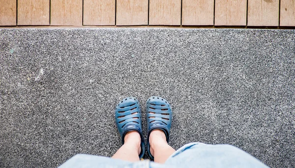 Vintage filter ,aerial view of grey cloth shoe with blue jean st — Stock Photo, Image