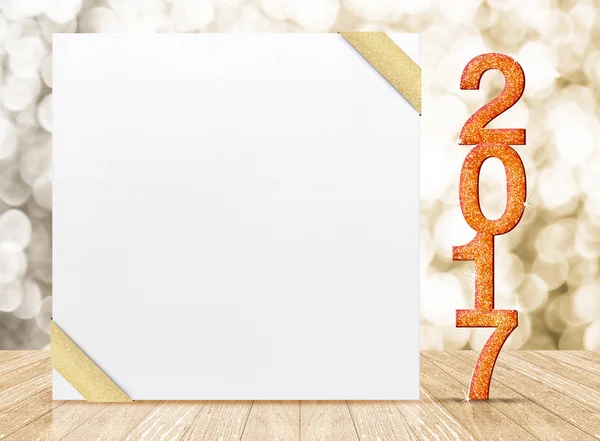 2017 New year glitter number and white card with gold ribbon in — Stock Photo, Image