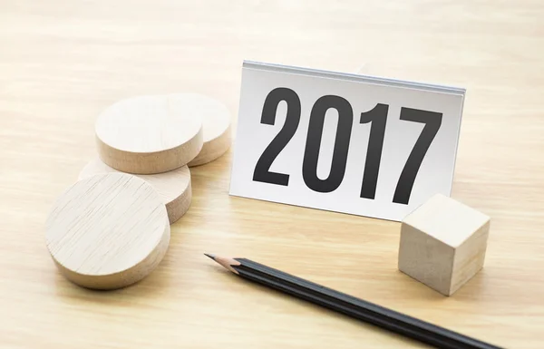 2017 new year on Business card with blank wooden round piece and — Stock Photo, Image
