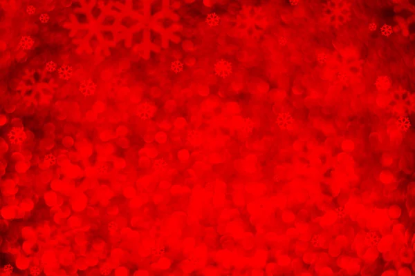 Floco de neve vermelho bokeh luz abstrato natal fundo — Fotografia de Stock