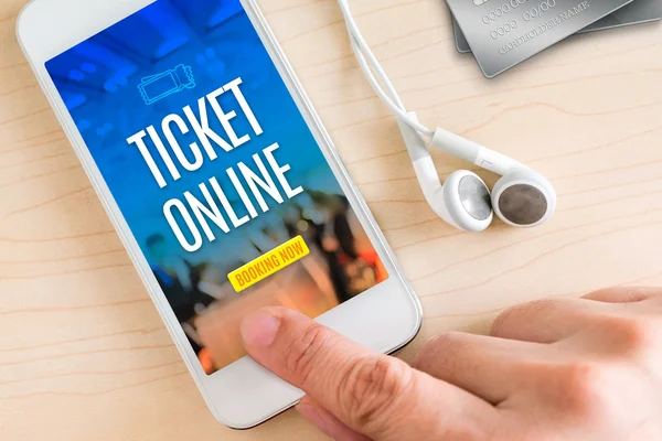 Hand touch smart phone and ear phone with Ticket online word on — Stock Photo, Image