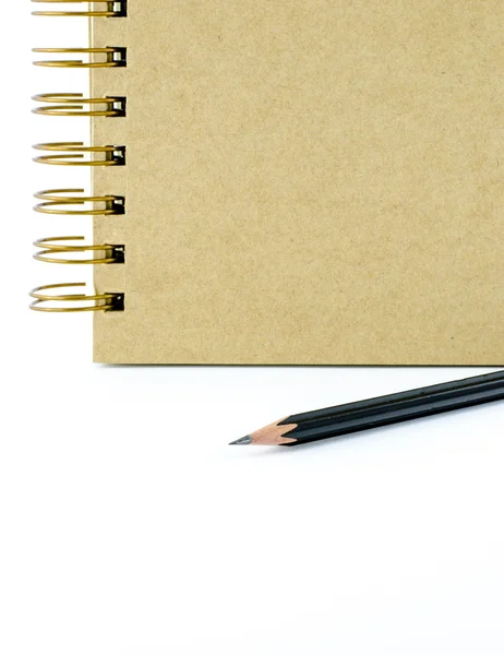 Close up black pencil with ring binder notebook on white backgro — Stock Photo, Image